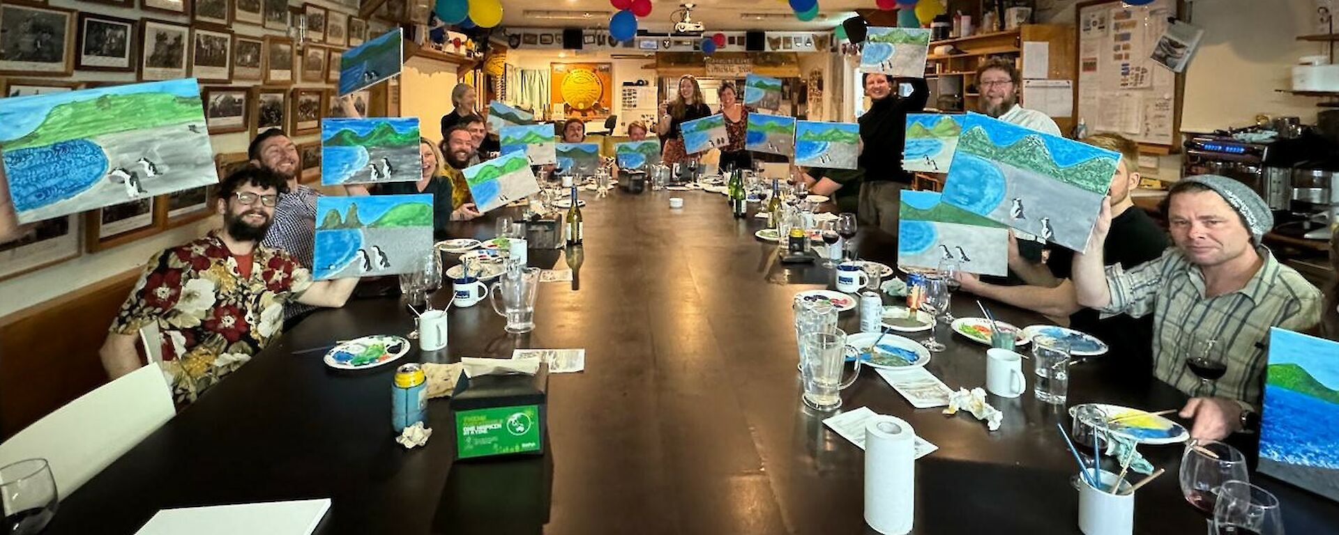 Macca expos around large dining table show they finished painting product