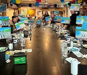 Macca expos around large dining table show they finished painting product