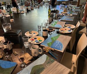 Paints under construction, on large dining table