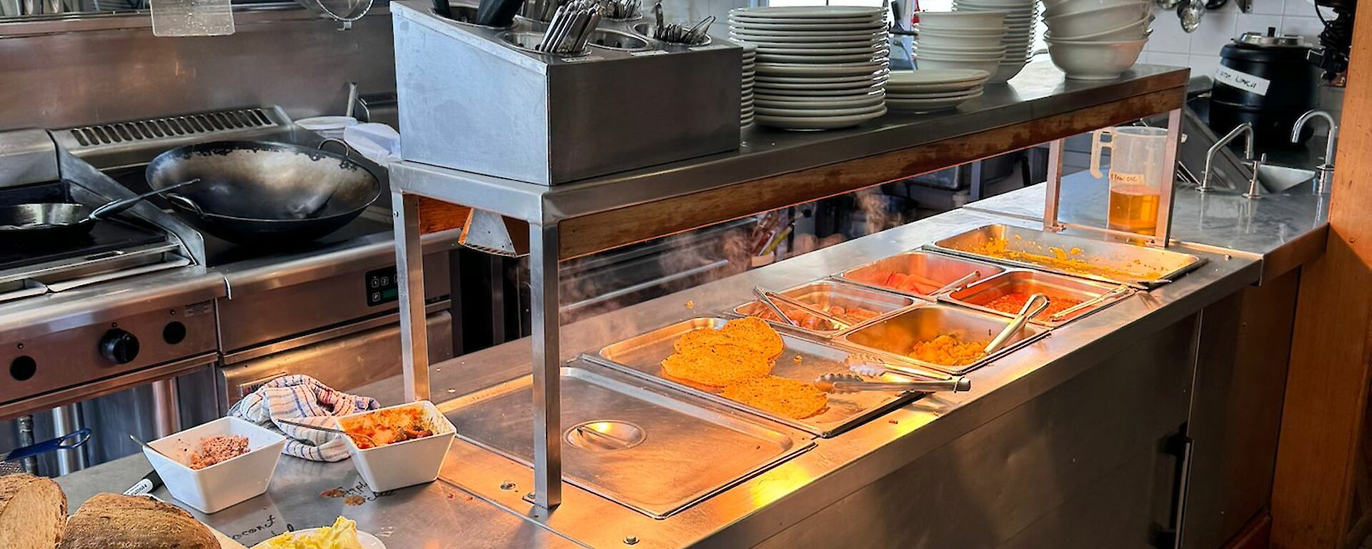 A bain marie filled with different types of food