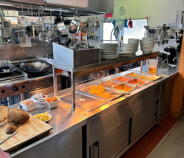 A bain marie filled with different types of food