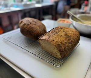 A handmade loaf of bread with a slice cut