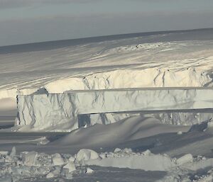 A view of the icecliffs and new iceberg to the east of station
