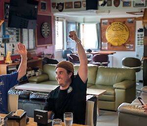 Pat raising his hand in the air to celebrate