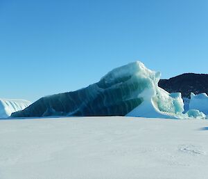 A distinctive jade berg near the Colbeck Archipelago resembling the appearance of salmon - except green