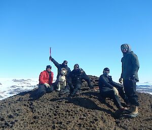 Five expeditioners and Stay at the summit of Ufs Island on a stunning Mawson coast day