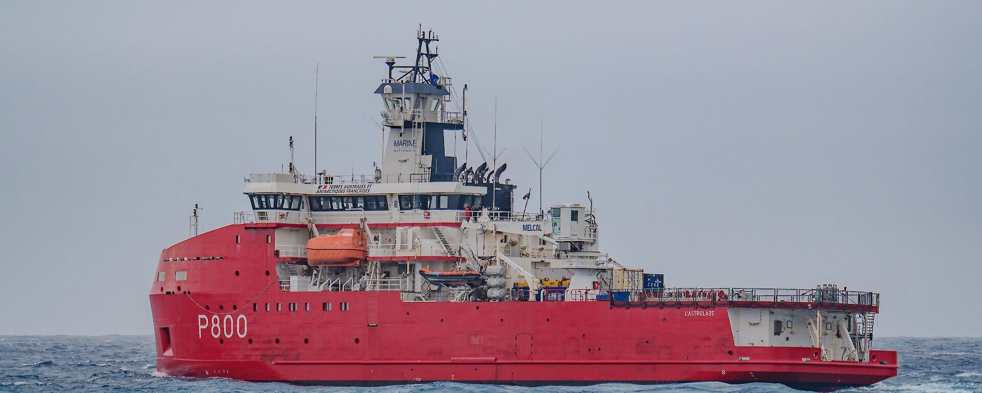 Large icebreaker ship, red hull and white superstructure