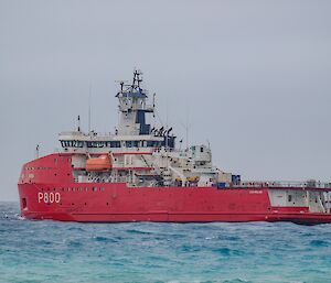 Large icebreaker ship, red hull and white superstructure