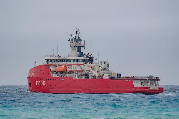 Large icebreaker ship, red hull and white superstructure
