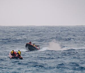 Two inflatable rubber boats in choppy waters
