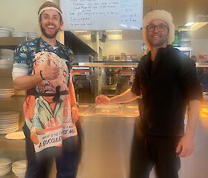 Two men in fancy dress in the dining area
