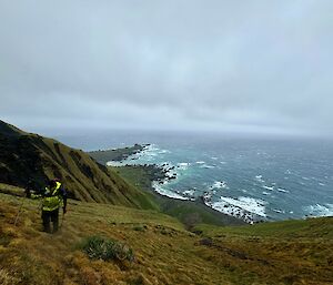 Expansive view of a rocky point with rough sea all around
