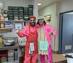 Two expeditioners dressed up brightly while doing slushy for the day