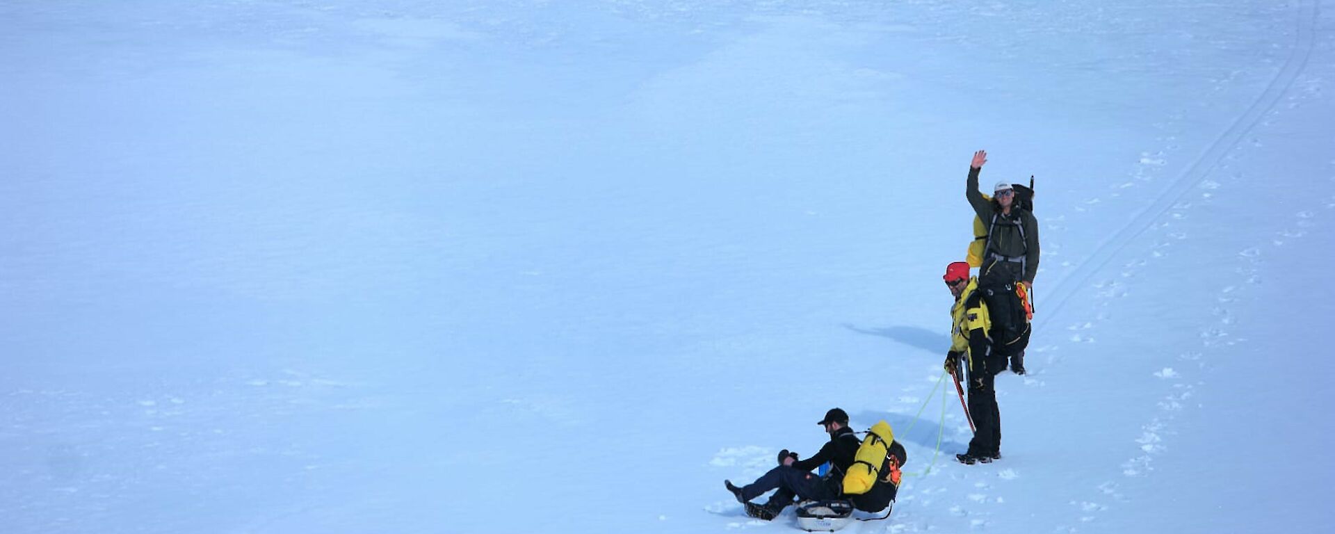 Three expeditioners preparing to walk back to Mawson from Bechervaise Island over the sea-ice