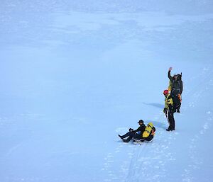 Three expeditioners preparing to walk back to Mawson from Bechervaise Island over the sea-ice
