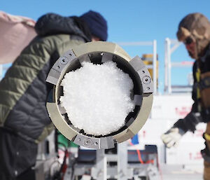 Close up view of the eclipse drill containing white ice