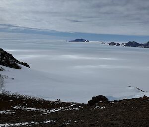 A view from the first saddle on route to Mt Parsons, overlooking the ice plateau and the Hagglunds at the base of the slope