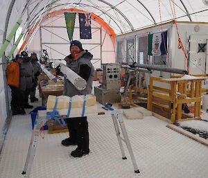 A man holding an ice core