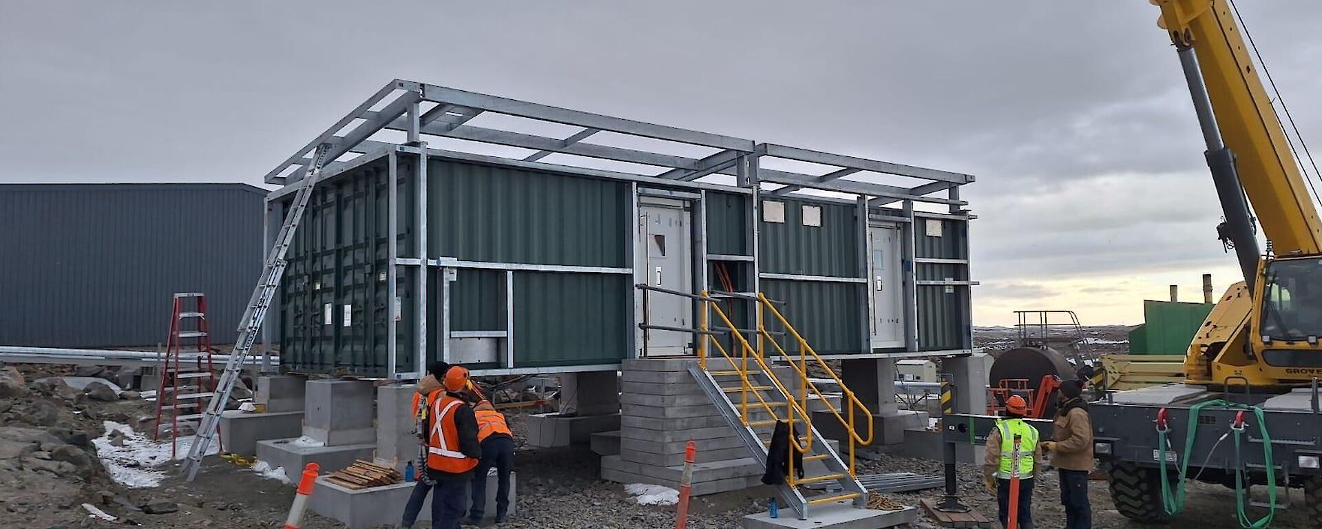 Big dark grey building like a shipping container