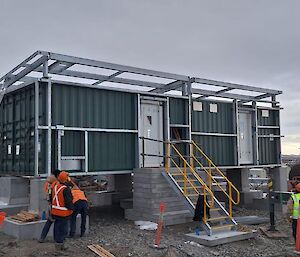 Big dark grey building like a shipping container