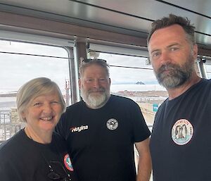 Voyage Leader and Deputy Voyage Leader and Dave Roberts incoming Station Leader on the bridge of the Nuyina before heading to station