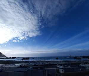 Stunning stripes of wispy, high cloud to the right and fluffy clouds, like snow, to the left