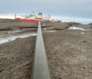 Refuelling line close-up with Nuyina in the background