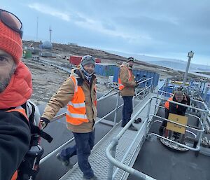 Expeditioners on top of the Mawson fuel farm