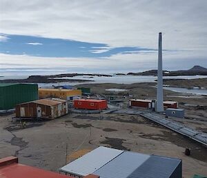 Shot of station showing all the different coloured buildings with snow and rocky hills in the background