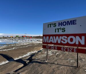 A sign on a rock saying 'It's Home, It's Mawson'