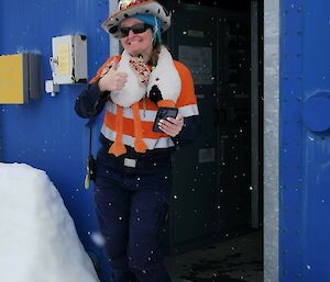 Image of expeditioner with plush toy draped around neck.