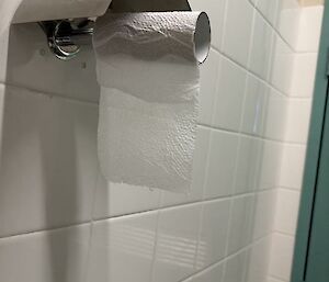 A toilet run with only two square of toilet roll on it