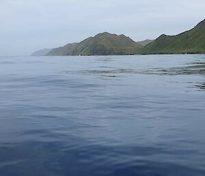 Photo taken from the IRB of smooth 'glassy' water conditions and island in the distance