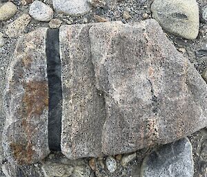 A black strip in a boulder