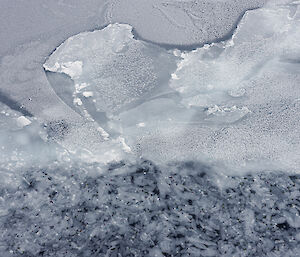 Aerial view of cracked and slushy ice