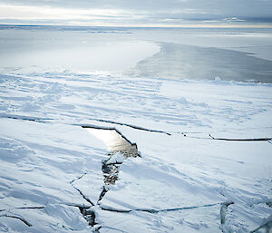 Looking down on a massive cracked ice shelf