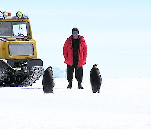 The author and 2 penguins next to a Haag on the ice