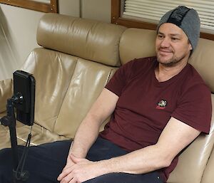 A man on a video call on his phone