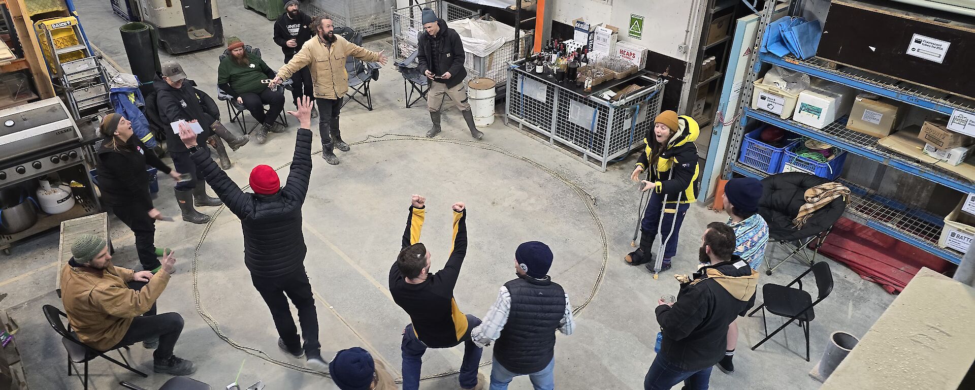 People playing two up in a shed