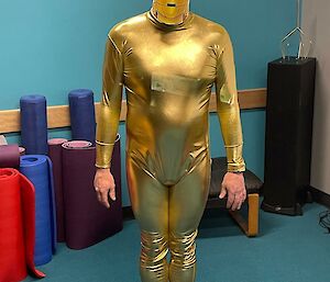 An expeditioner dressed as a gold Star Wars figure