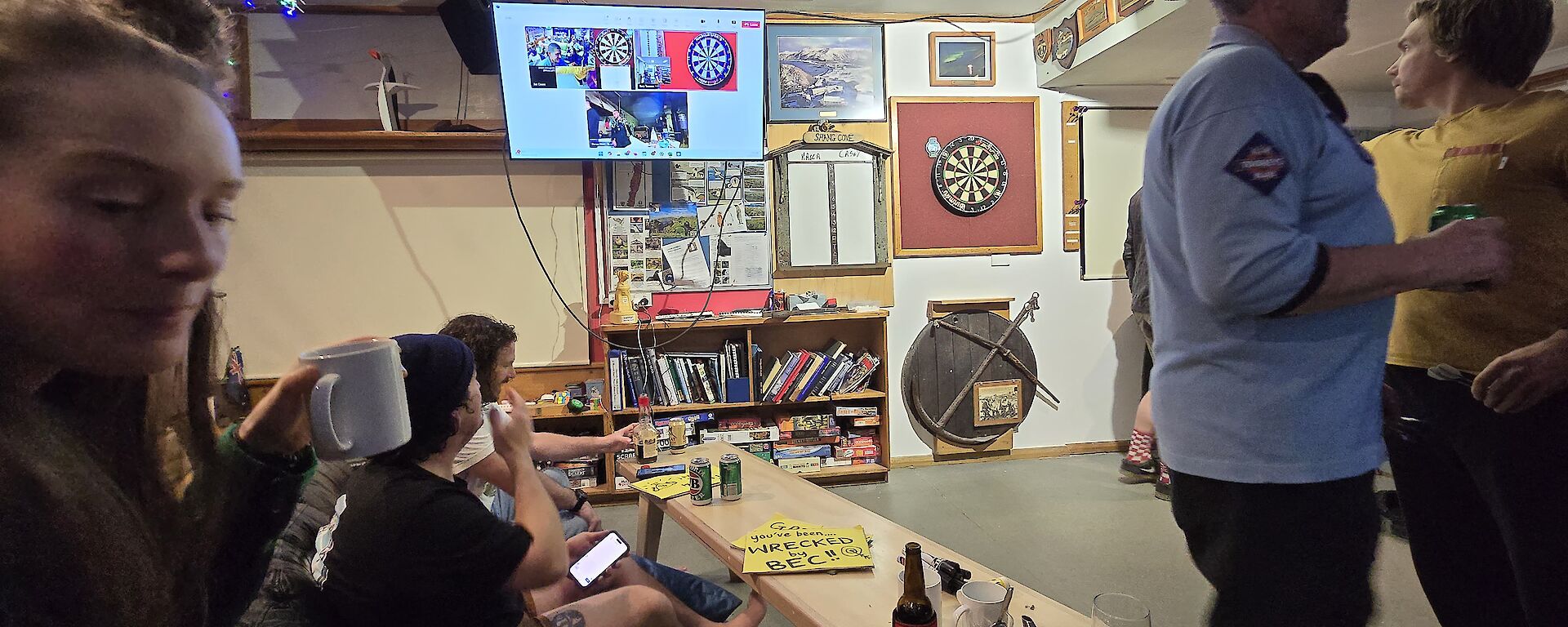 People in front of a darts board