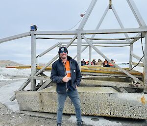 The authro standing in front of the pontoon that he rebuilt