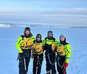 Four expeditioners standing on the ice after doing Sea Ice testing