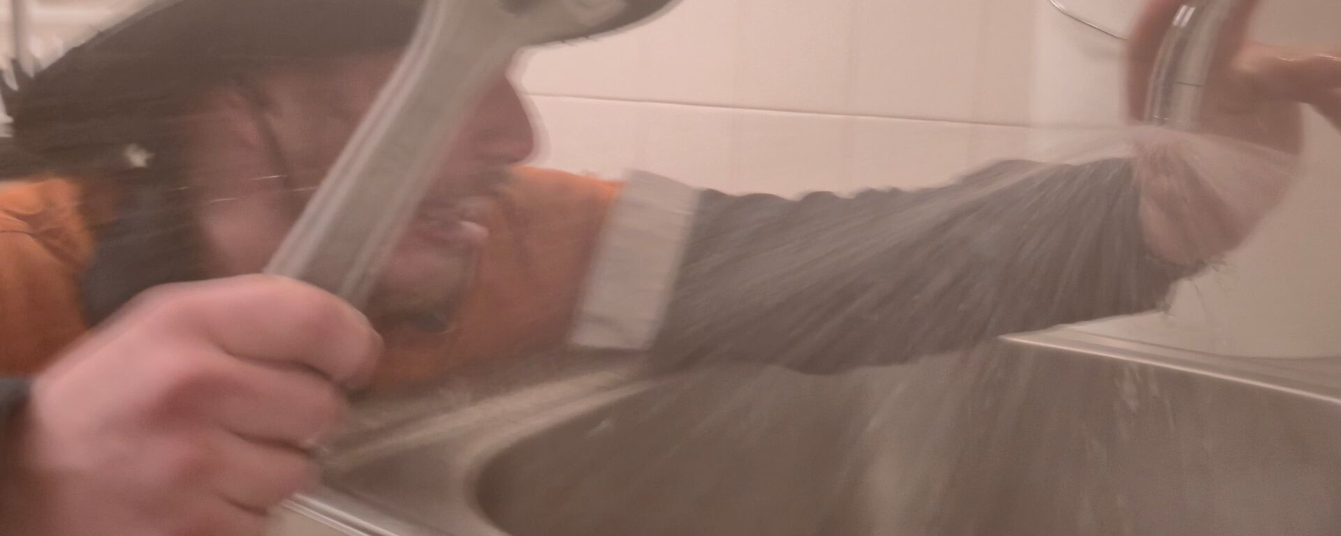 A Casey Station plumber fixing a leaking tap