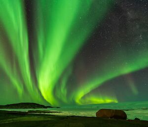 Beautiful green streaky sky over a bay