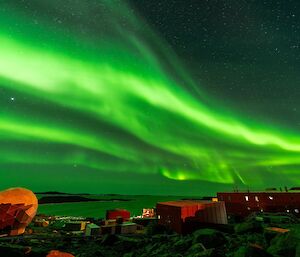 Vivid green streaky sky over station