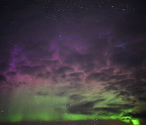 green and purple shimmers in the clouds