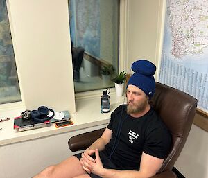 An expeditioner doing crochet