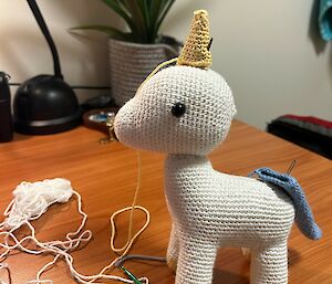 A crochet unicorn in progress