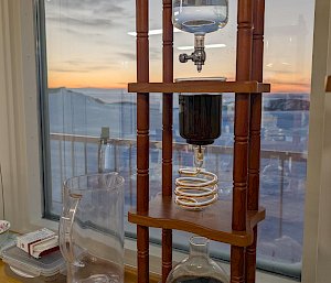 An elaborate contraption of glass vials through which coffee is trickling